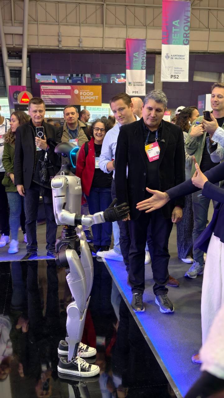 Visitors watching a humanoid robot demonstration at Web Summit